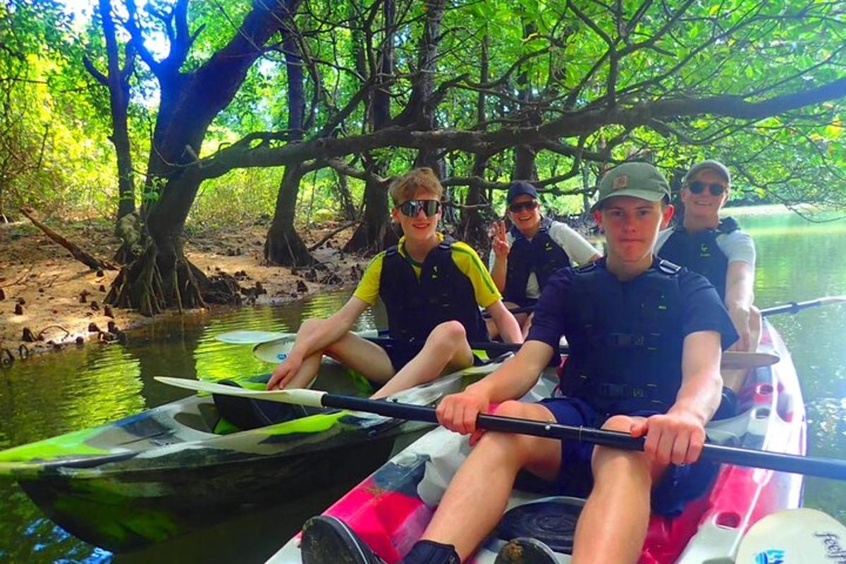 a group of people kayaking on a river
