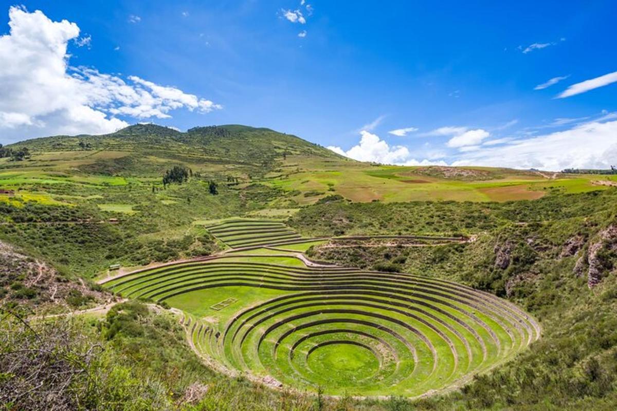 an amphitheater in the hills with mountains in the background