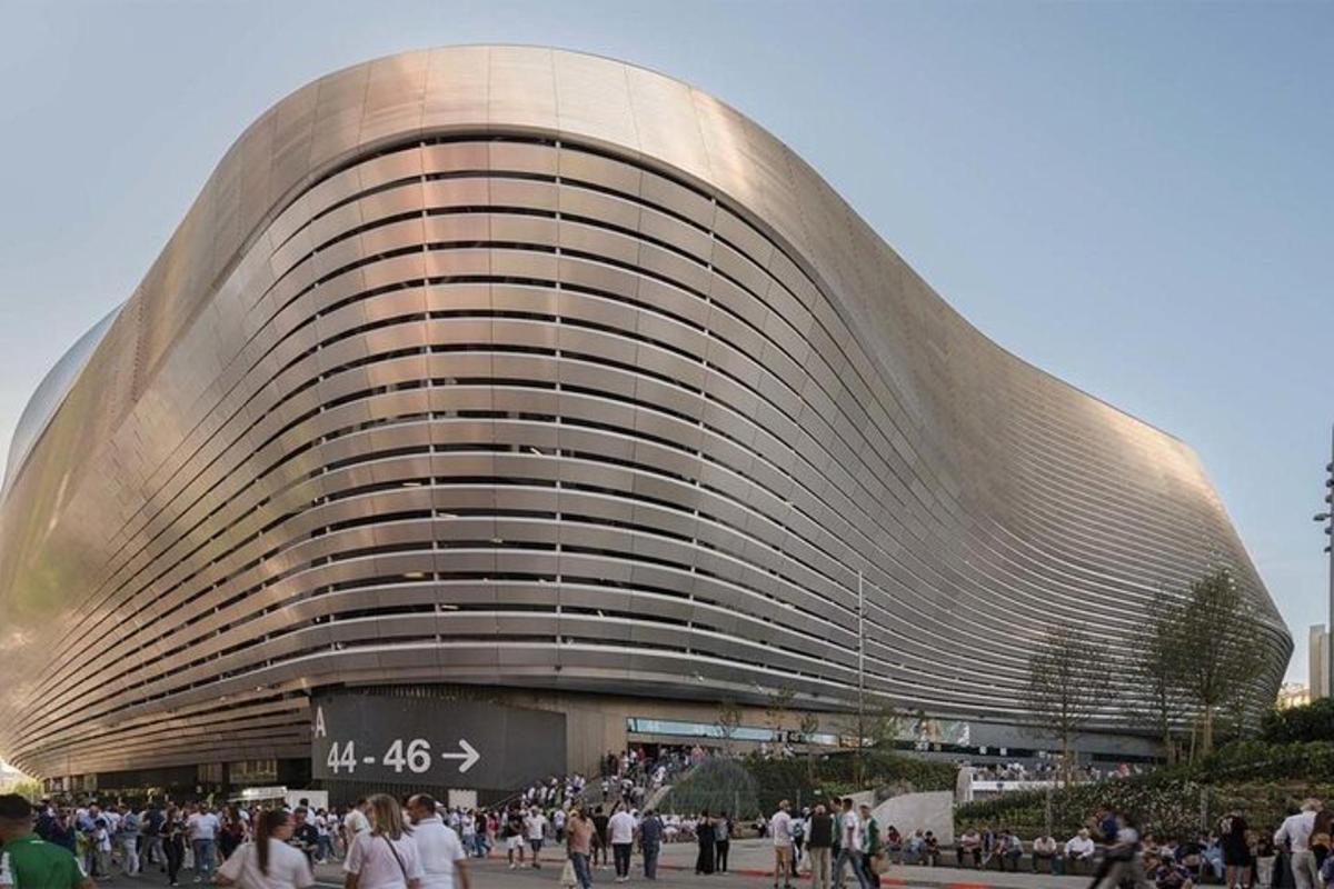 a large building with people standing outside of it