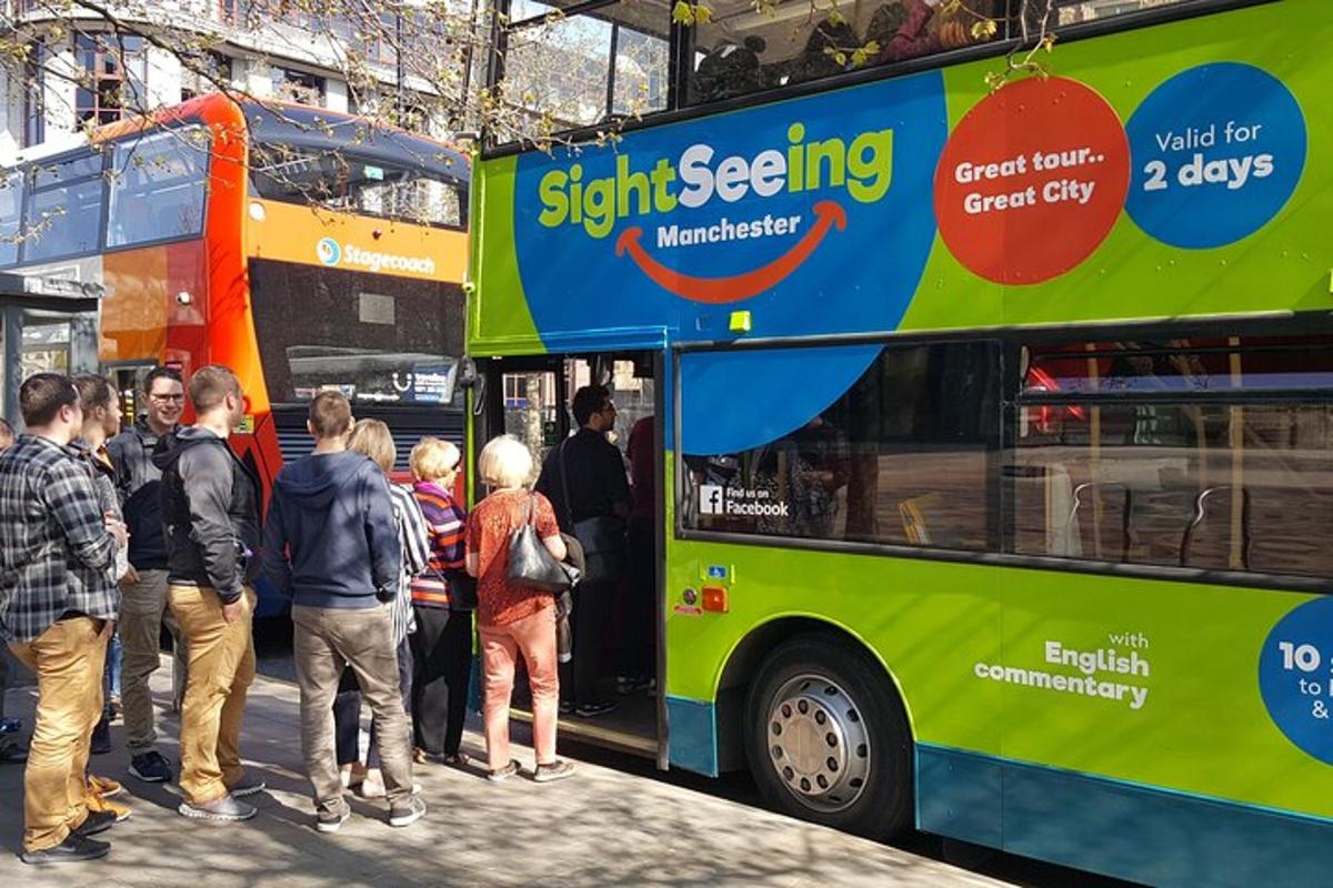 a group of people getting on a bus