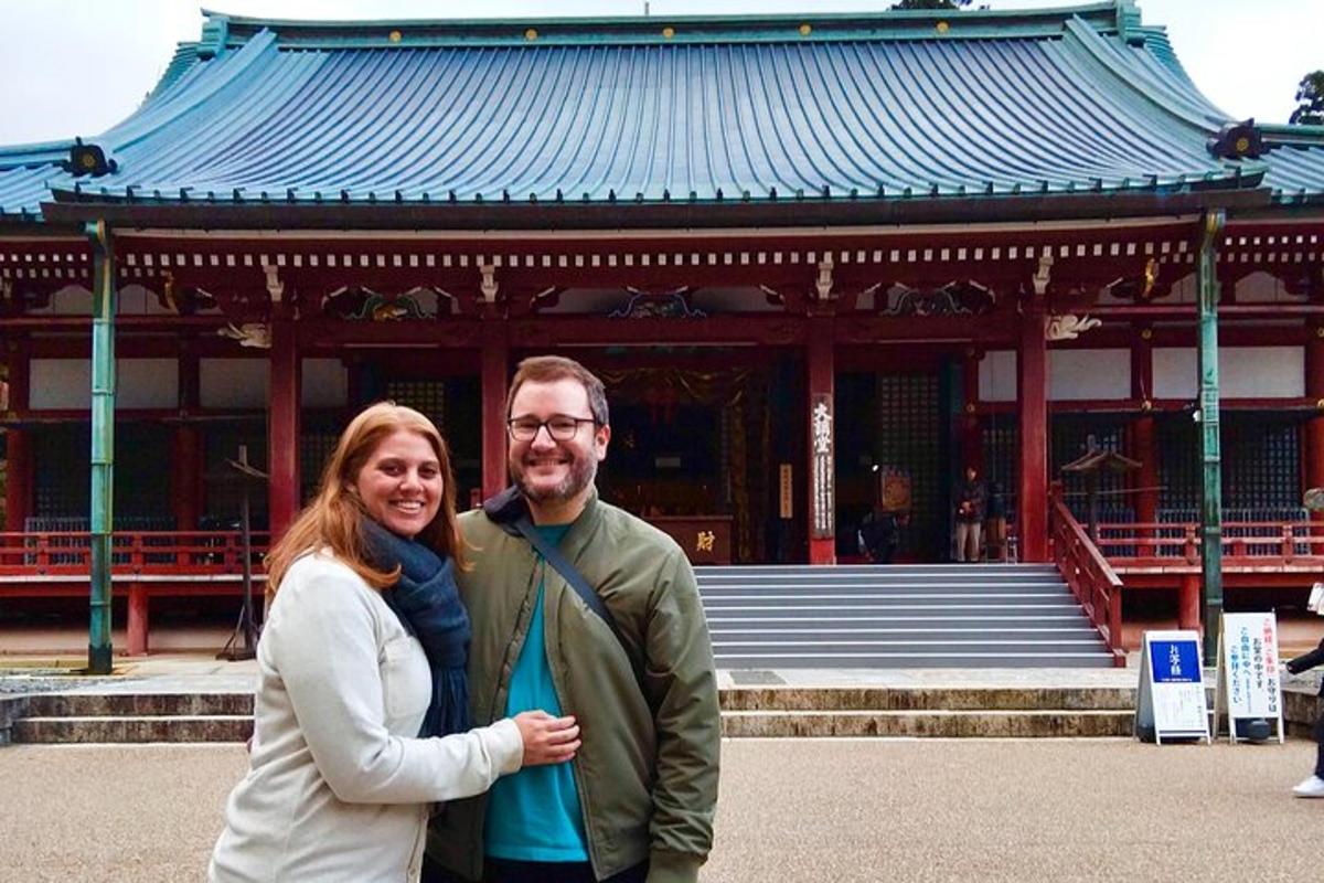 a man and a woman standing in front of a building
