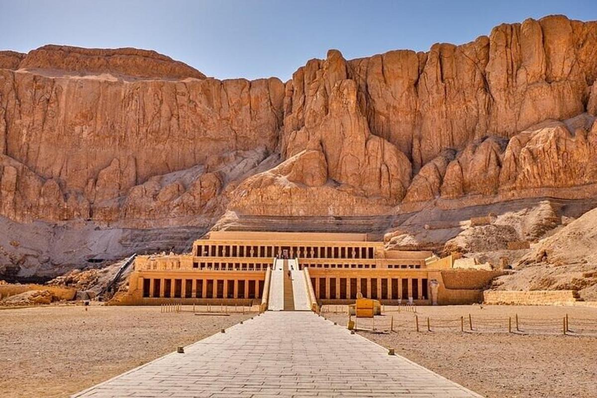 a building in the desert with a mountain
