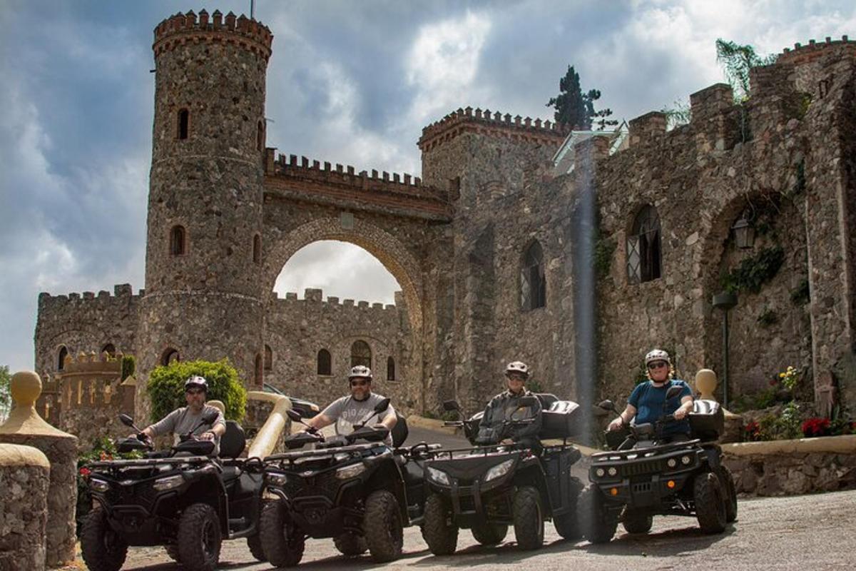 a group of people riding atvs in front of a castle