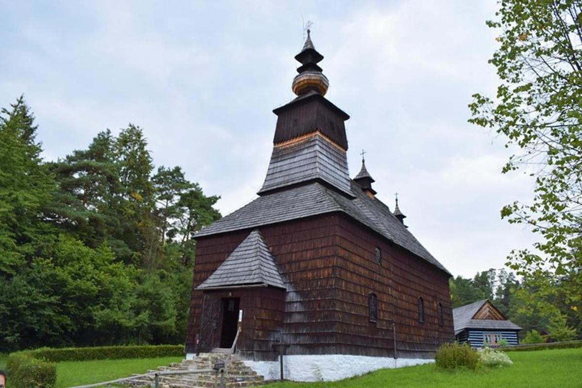 an old brick church with a cross on the top