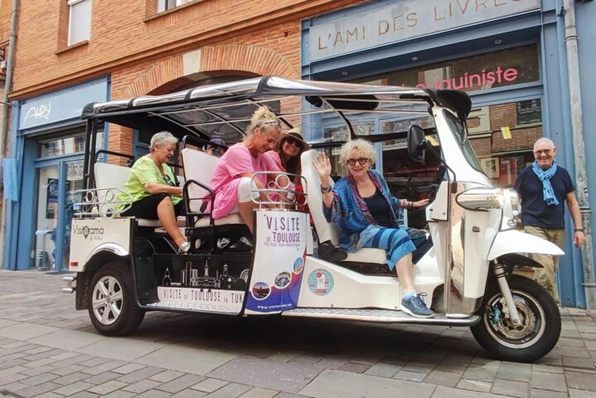 a group of people riding in a golf cart