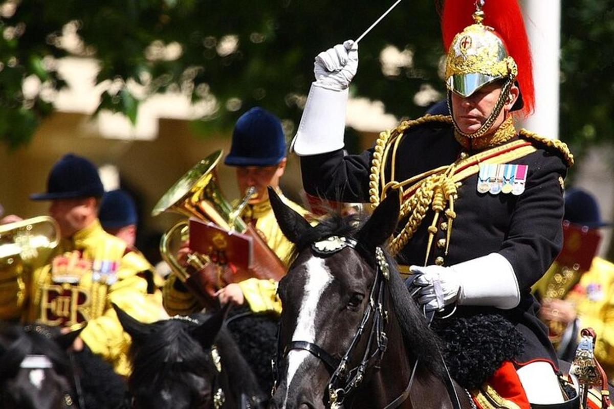 a group of men in costumes riding on horses