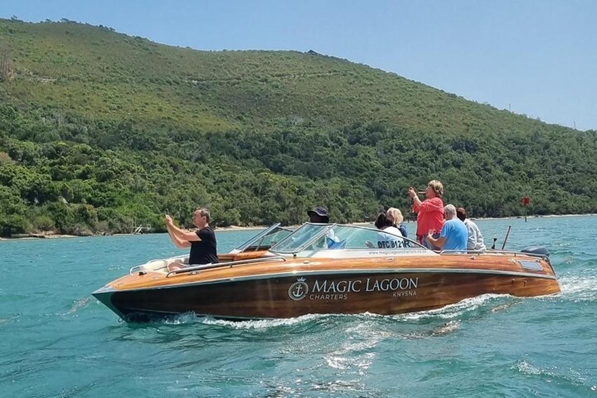a group of people on a boat in the water