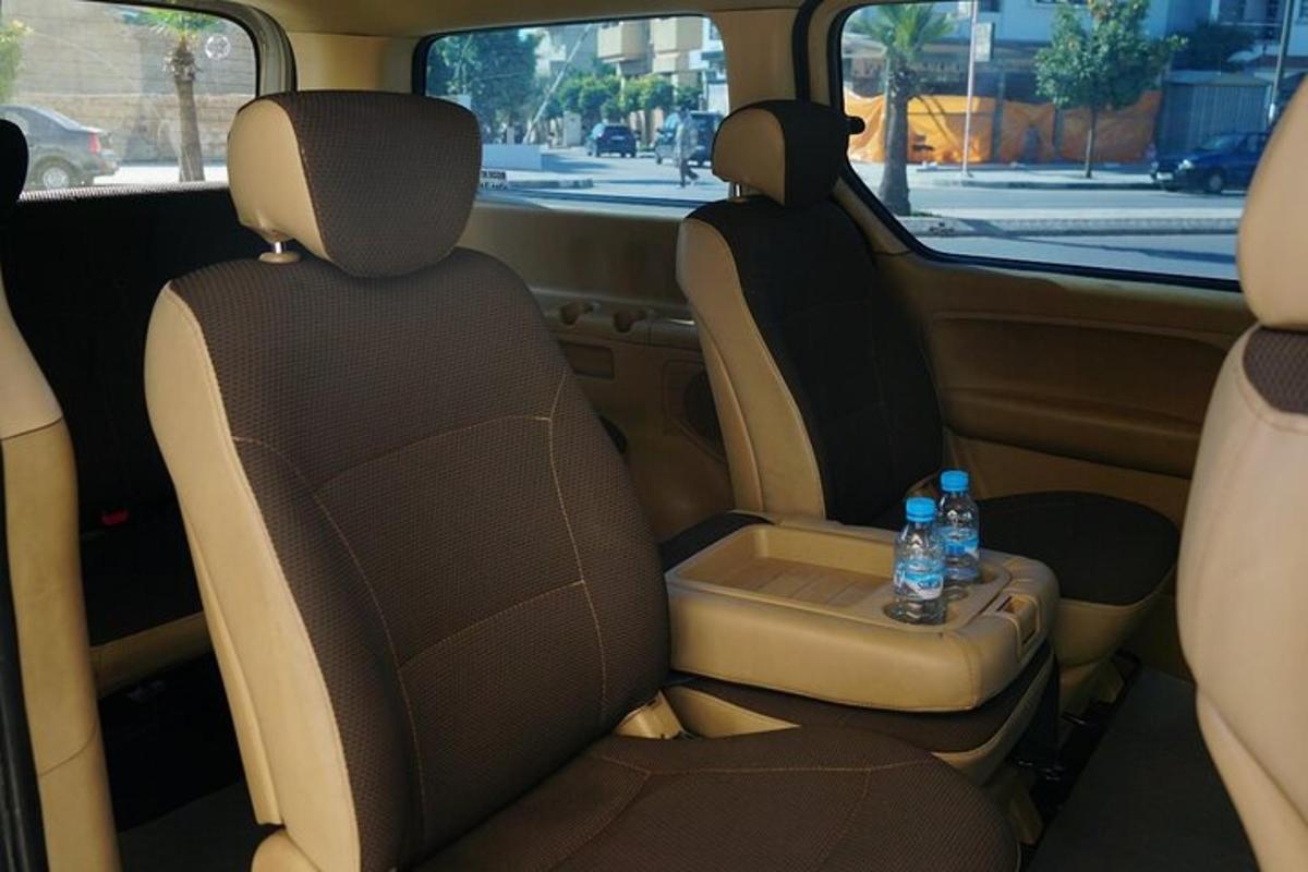 two bottles of water sitting in the back seats of a car