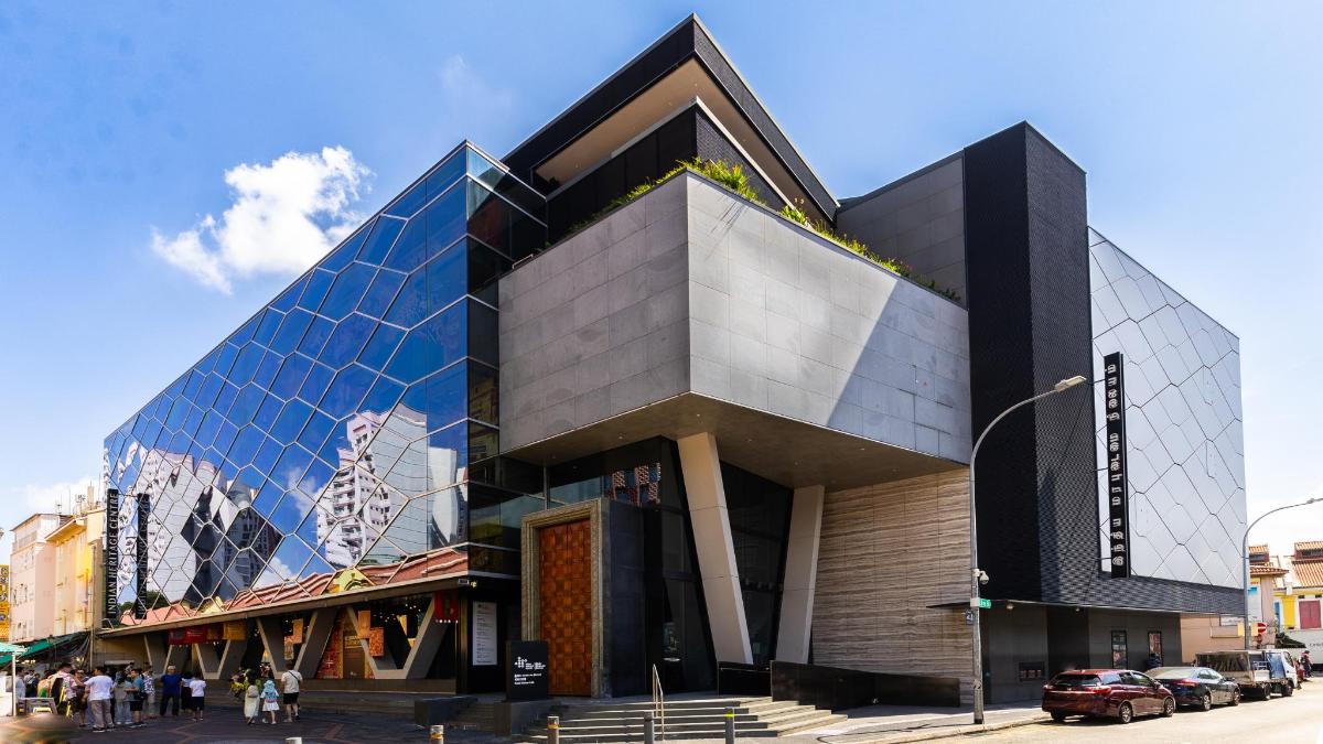 a building with a glass facade on a city street