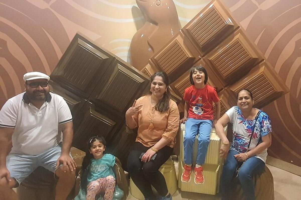 a group of people sitting on chairs in a room