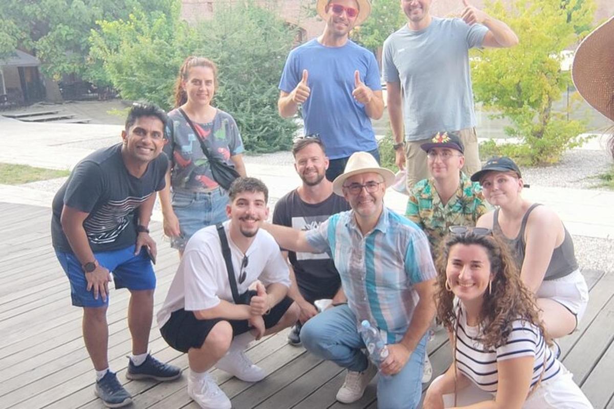 a group of people posing for a picture on a deck