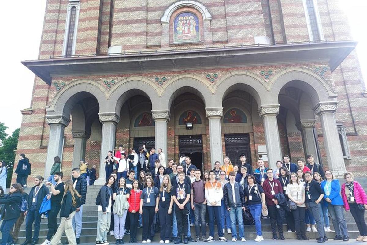 a group of people standing in front of a building