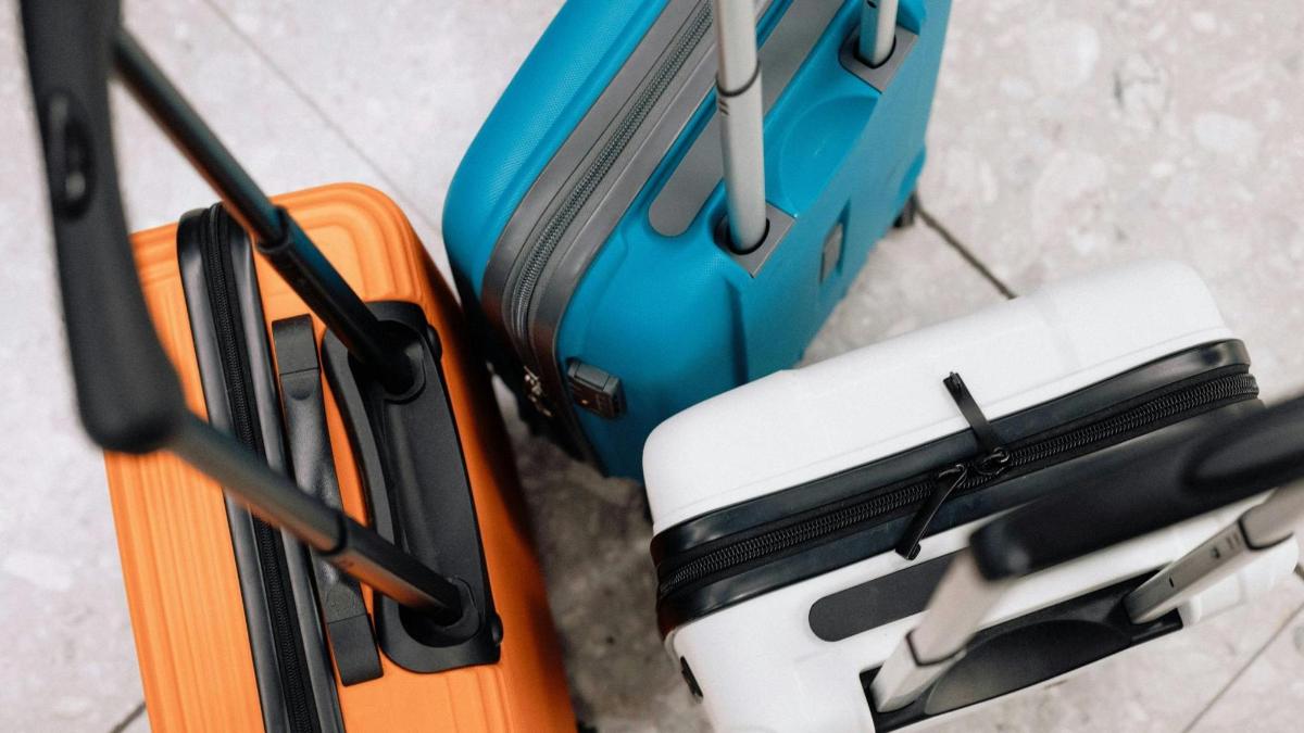 two pieces of luggage sitting next to each other