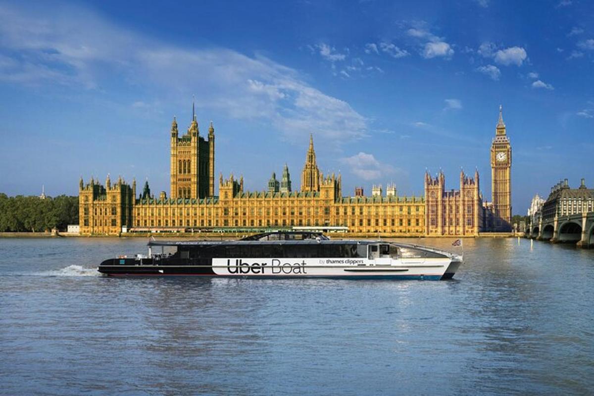 a boat in the water in front of a large building