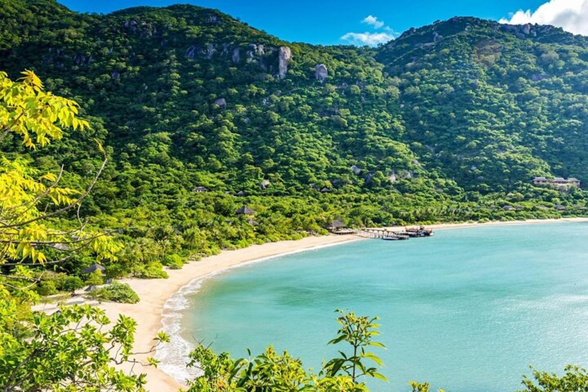 a view of a beach with mountains in the background