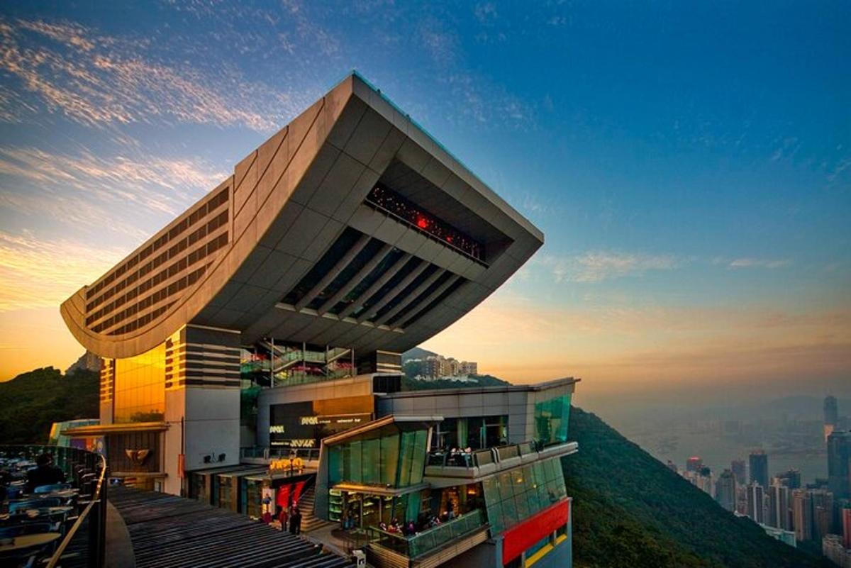 a building on top of a hill with a city