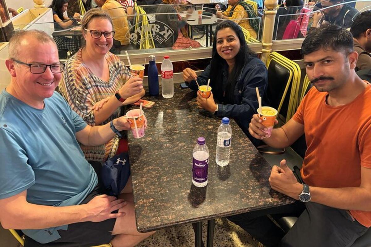 a group of people sitting at a table with drinks
