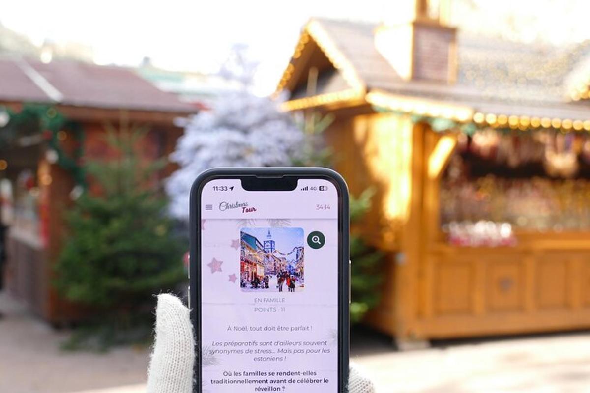 a person holding a cell phone in front of a store