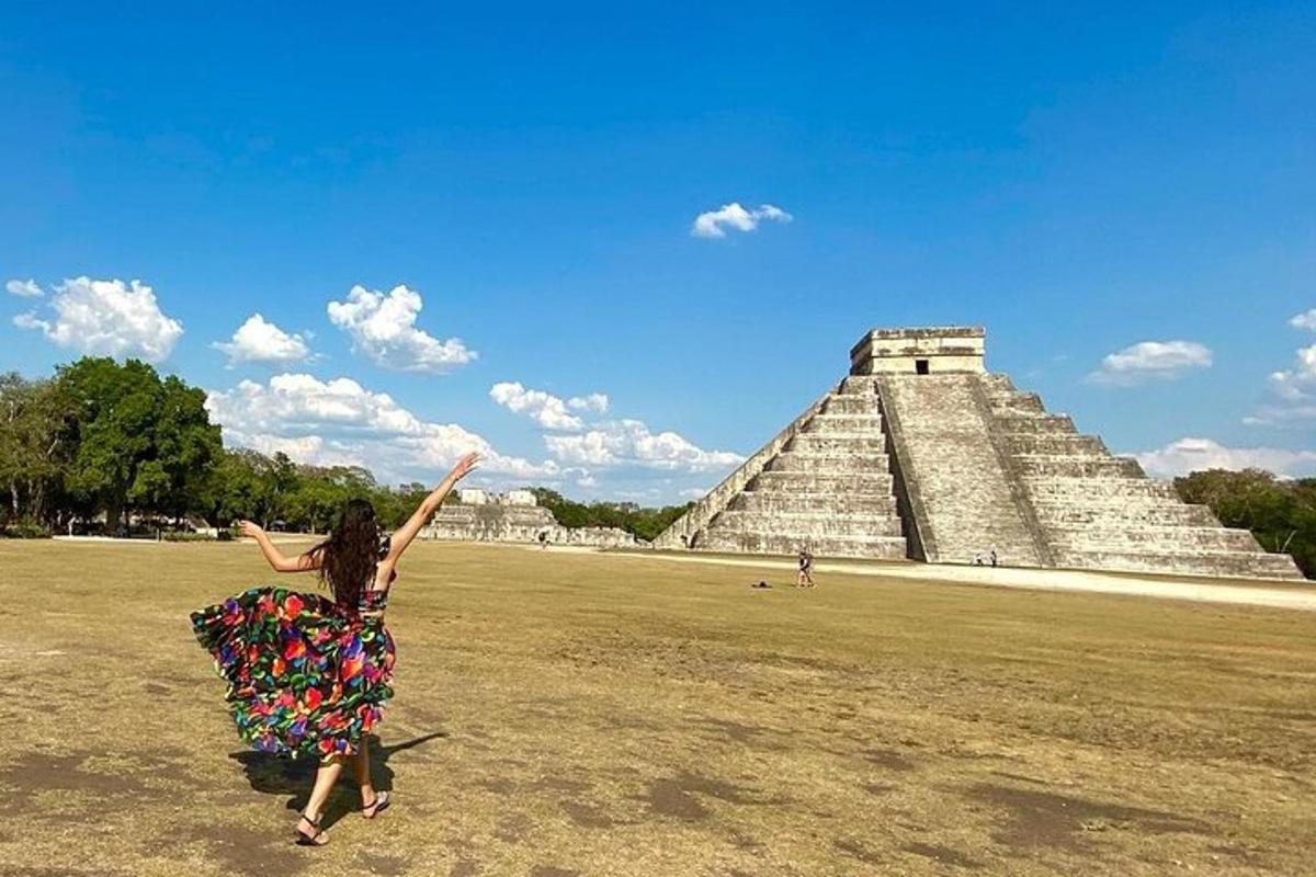a woman jumping in front of the pyramid
