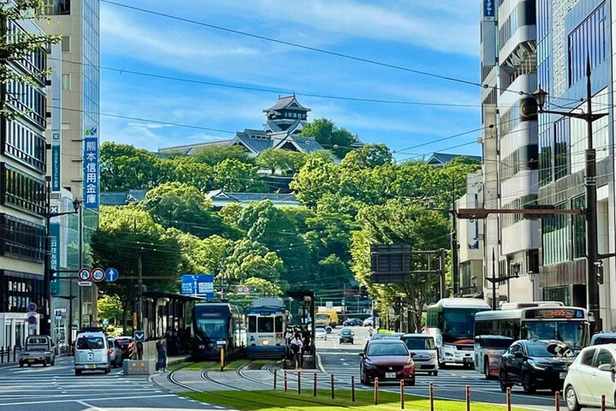 a busy city street with cars and a tower