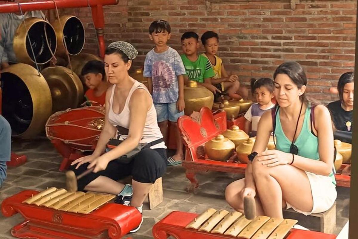 a group of young people sitting in a room with food