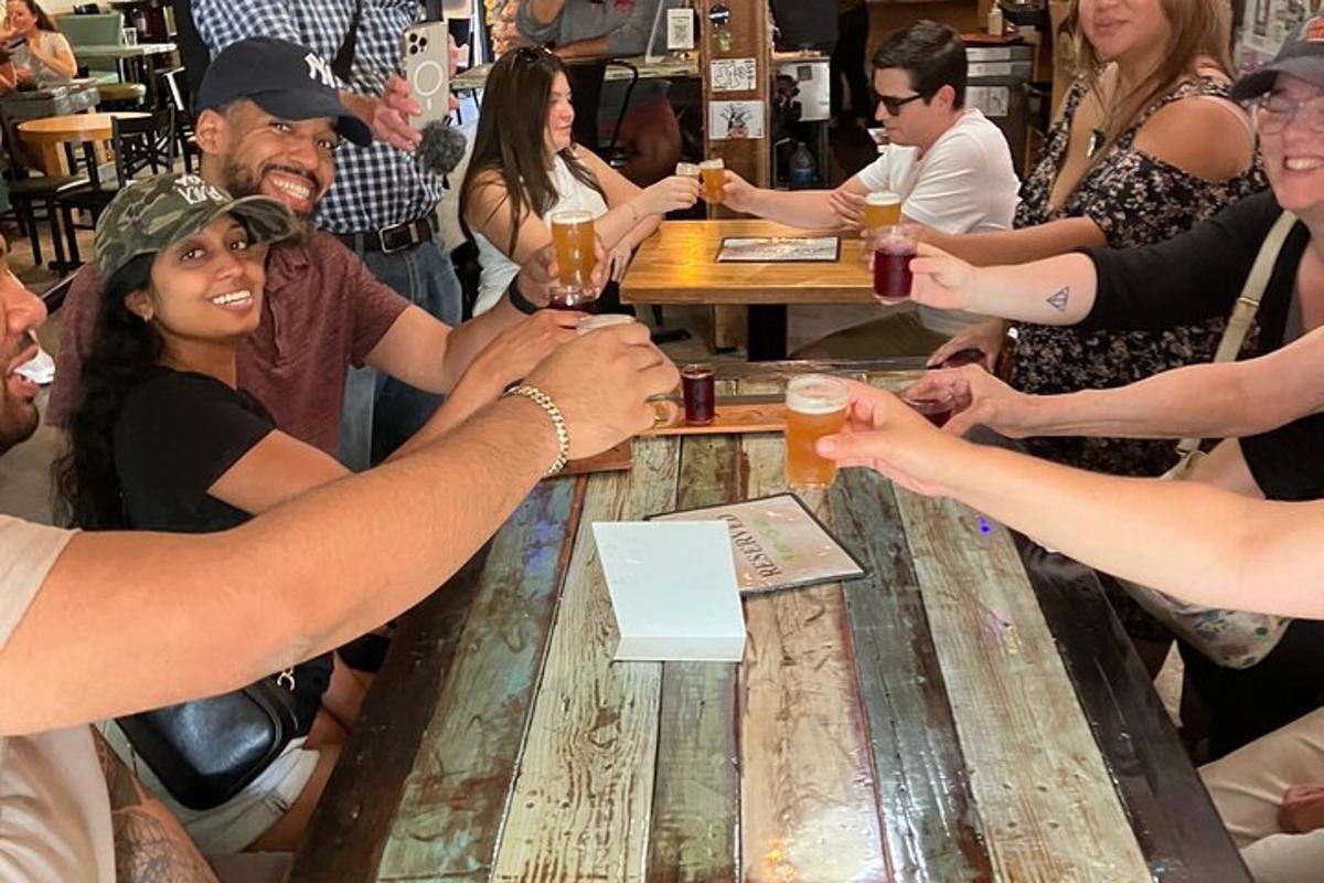 a group of people sitting around a table with drinks