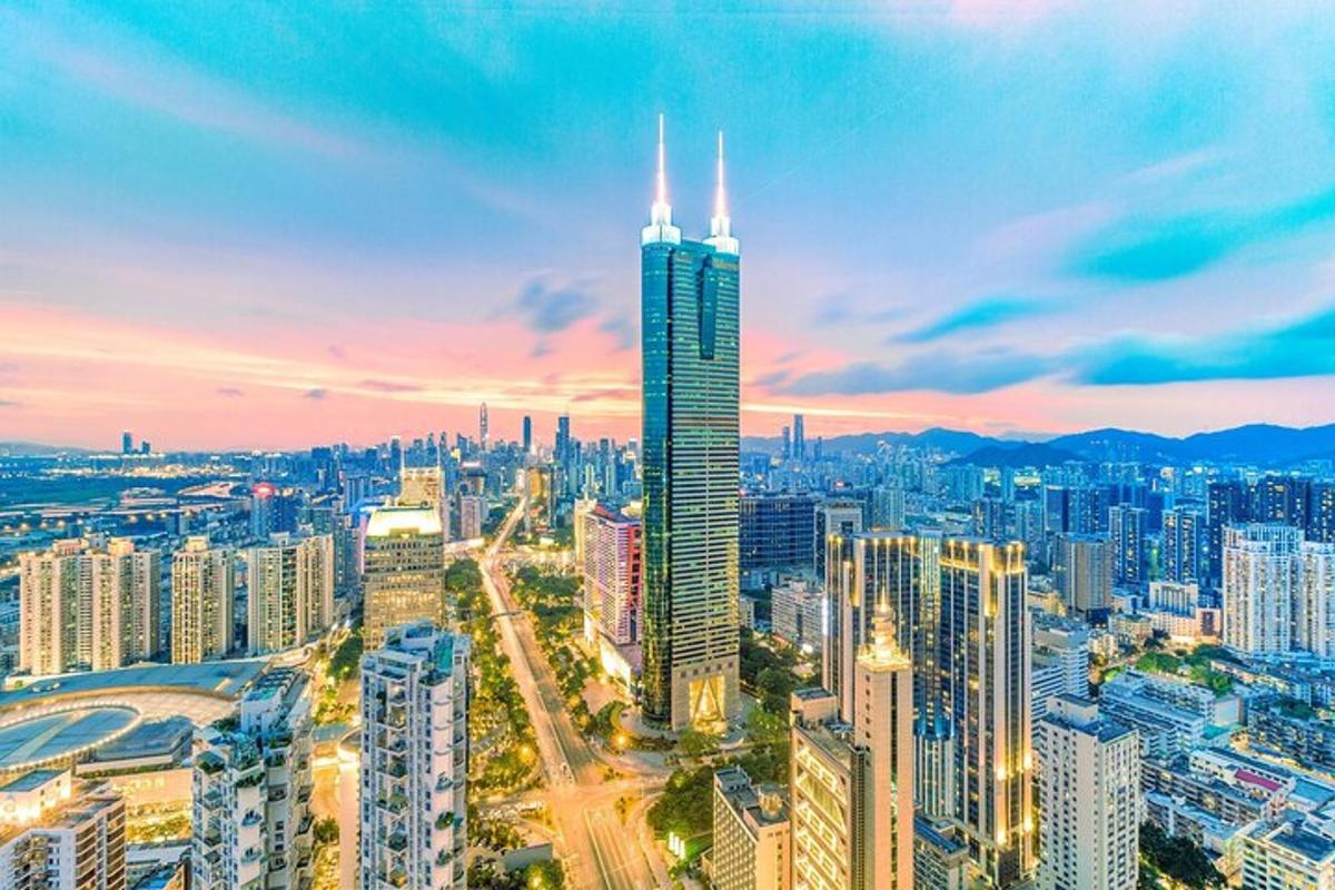 a view of a city with a tall skyscraper