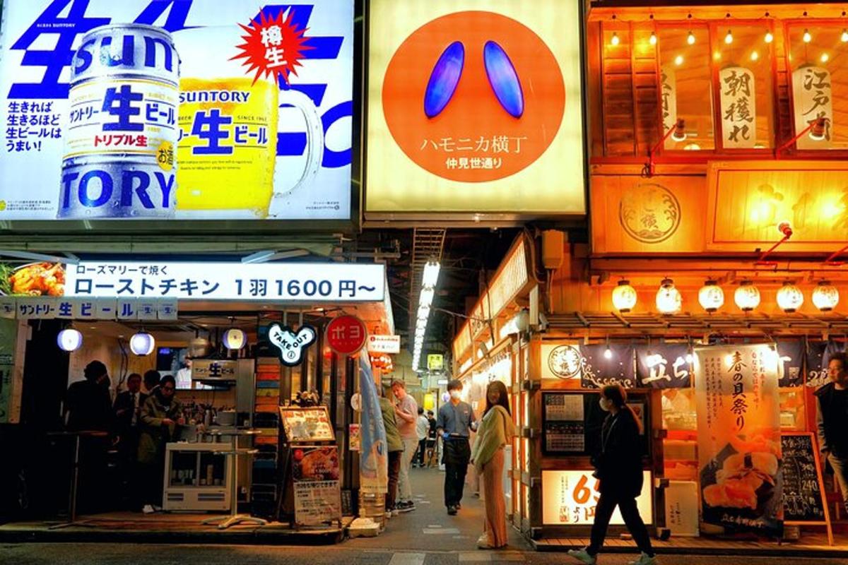 a group of people walking in a street with signs