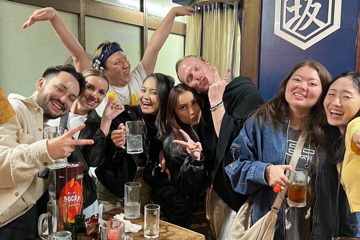 a group of people posing for a picture at a table