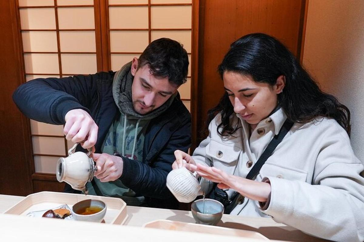 a man and woman sitting at a table eating food