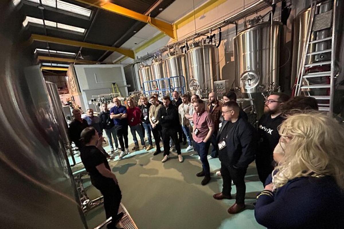 a crowd of people standing around in a room