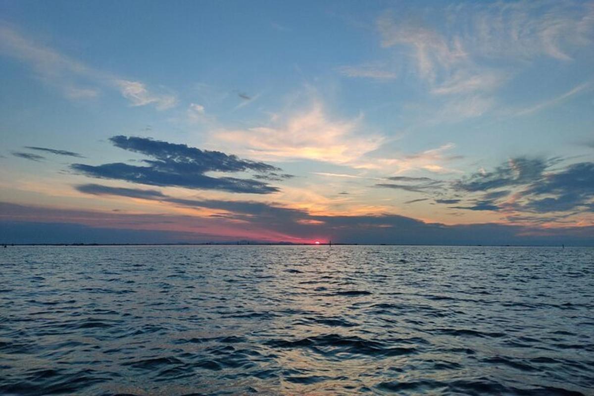 a sunset over a large body of water