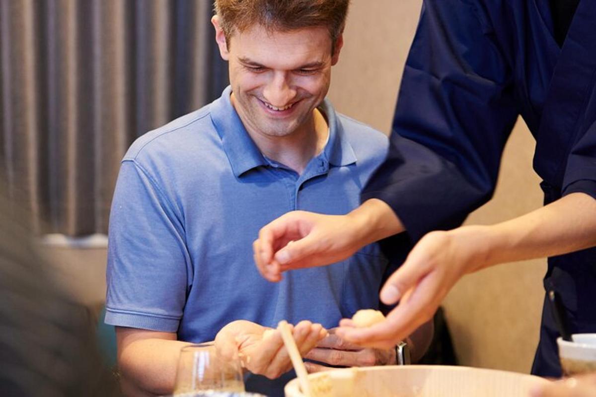 a man is preparing food in a kitchen