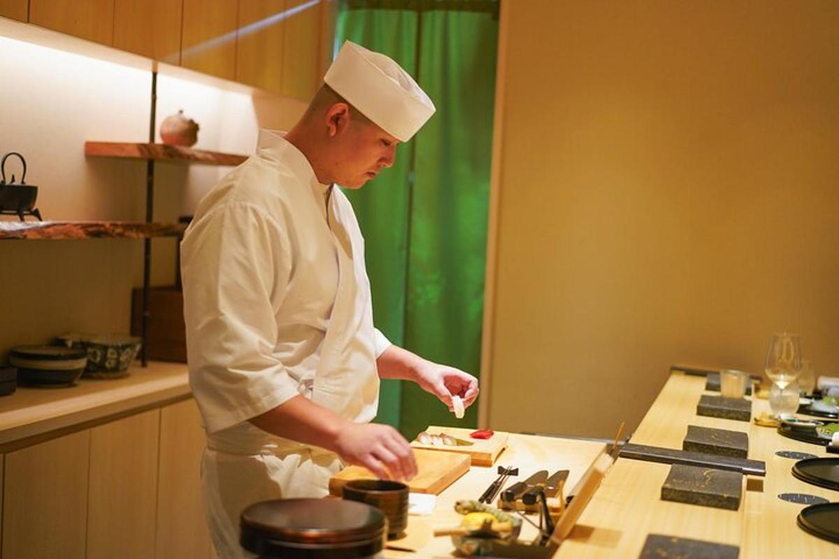 a chef standing in a kitchen preparing food