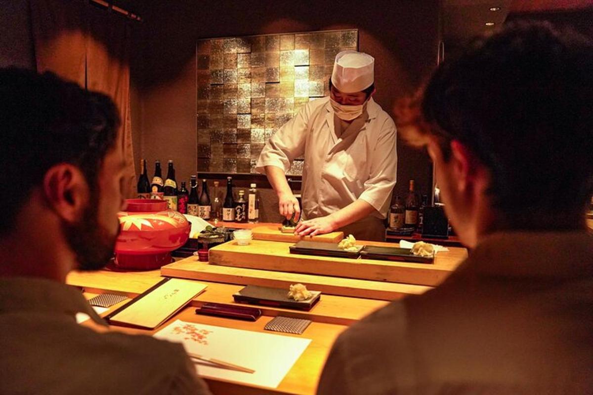 a chef preparing food in front of a group of people