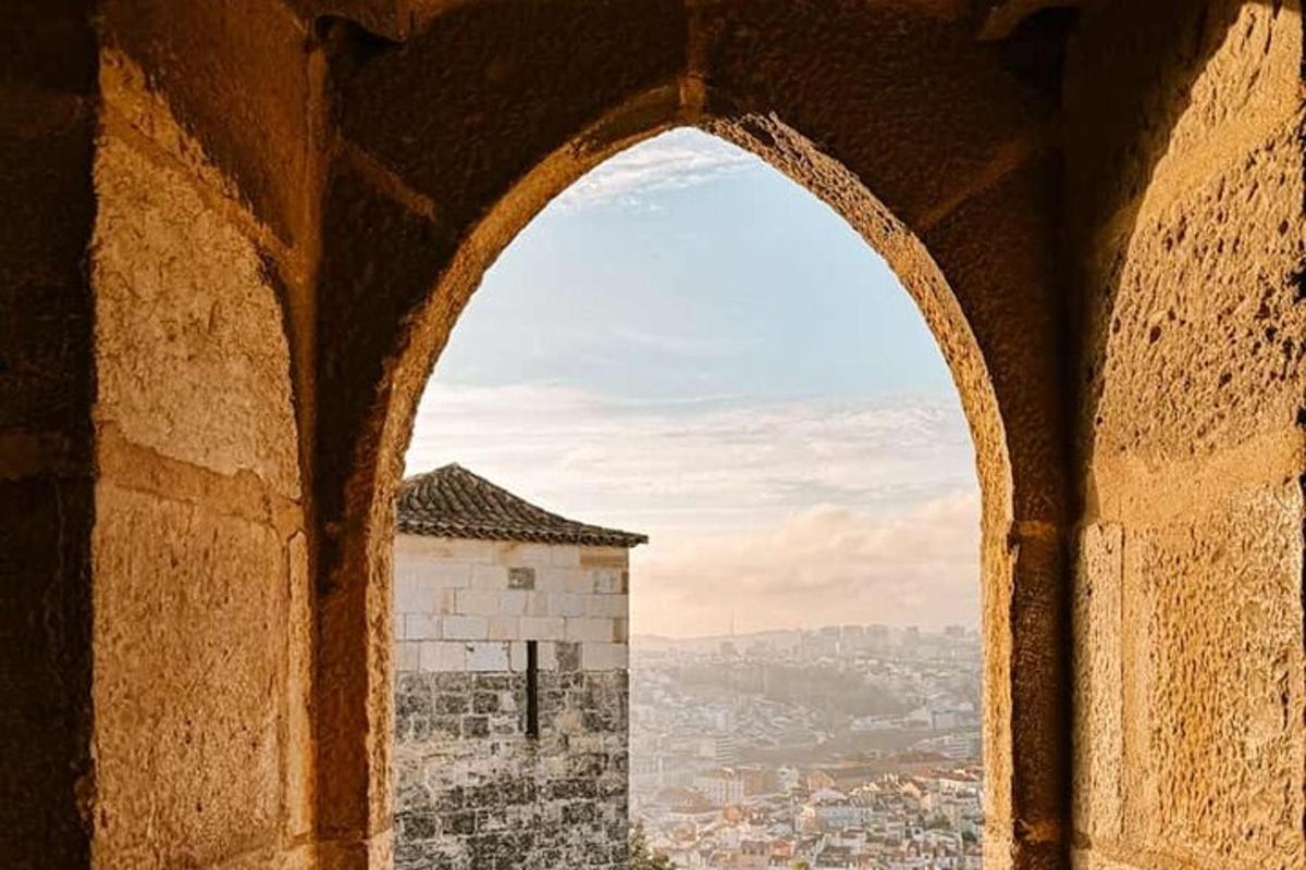 an arch in a building with a view of a city
