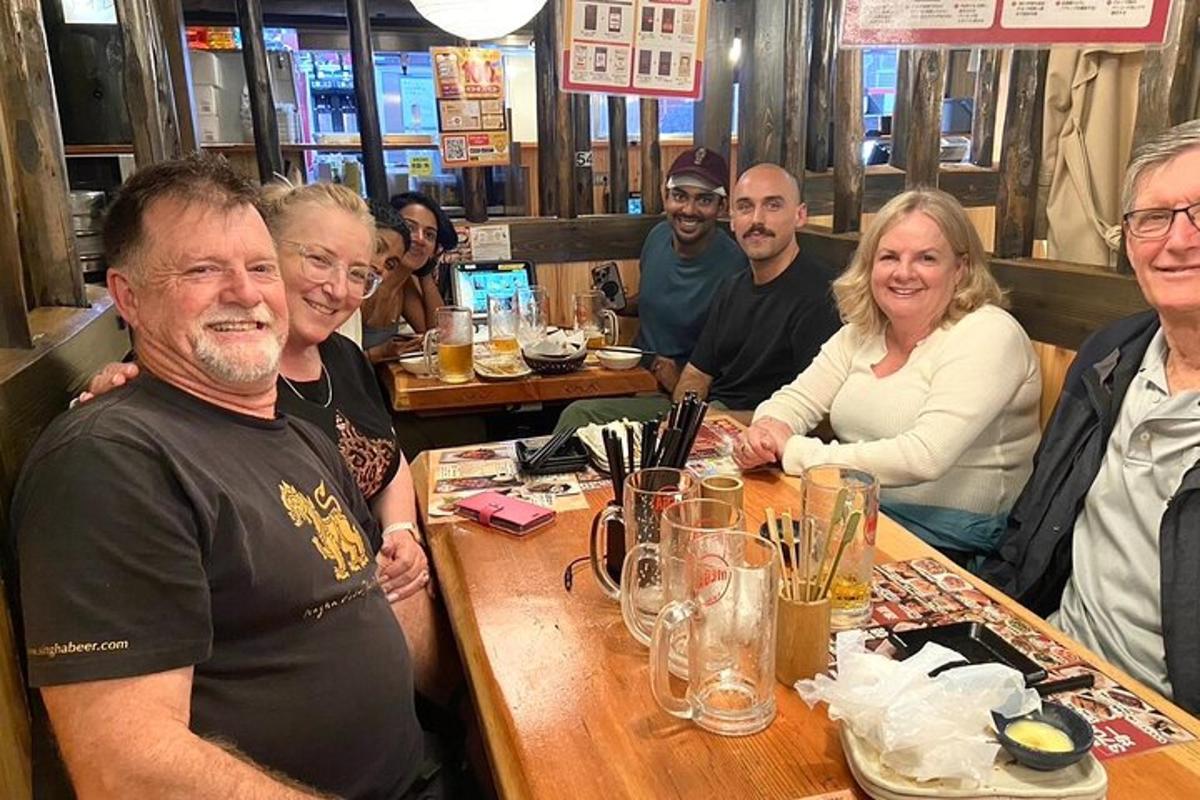 a group of people sitting at a table in a restaurant