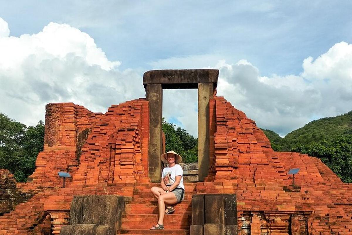 a young boy sitting on top of a brick building