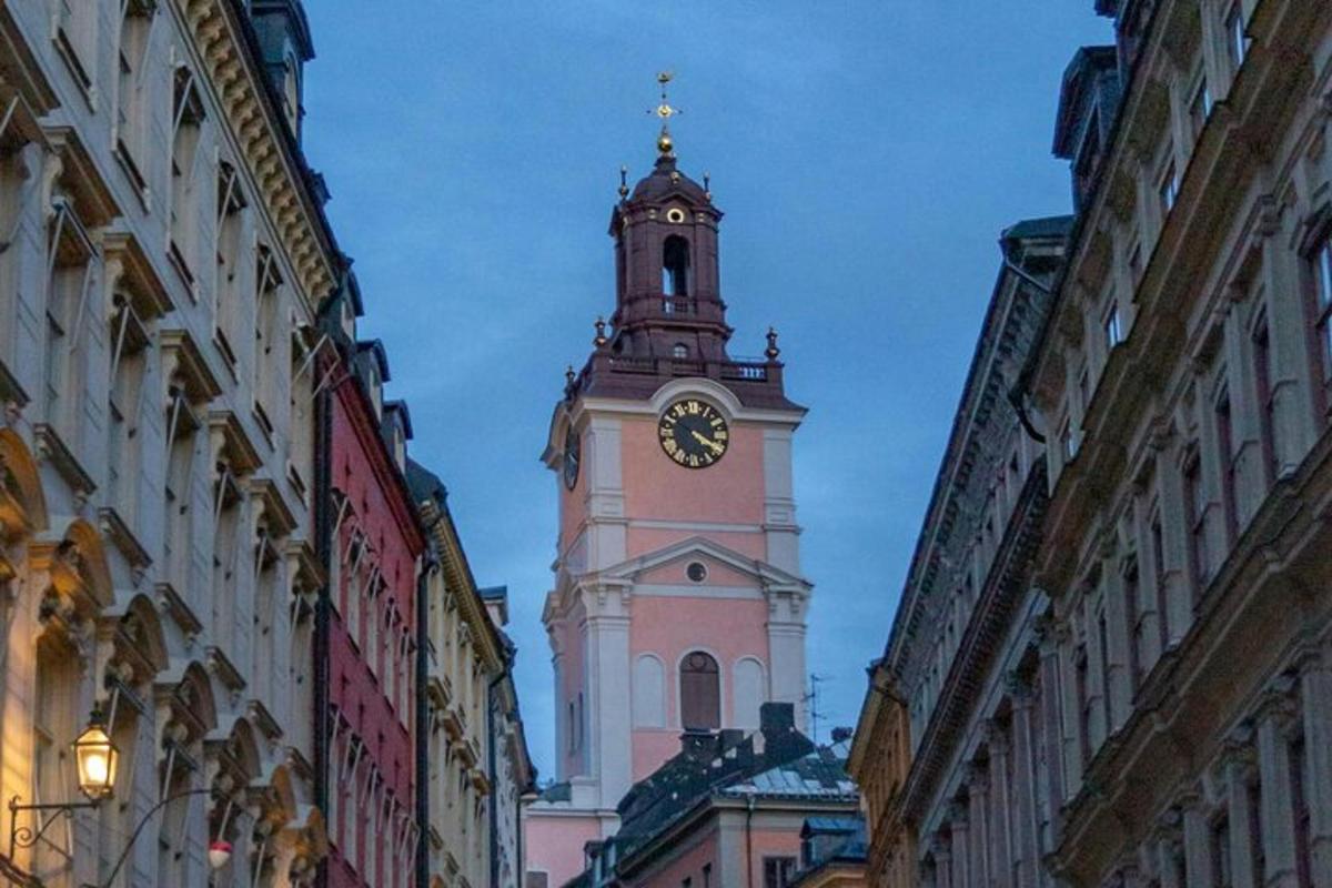 a clock tower in the middle of a city