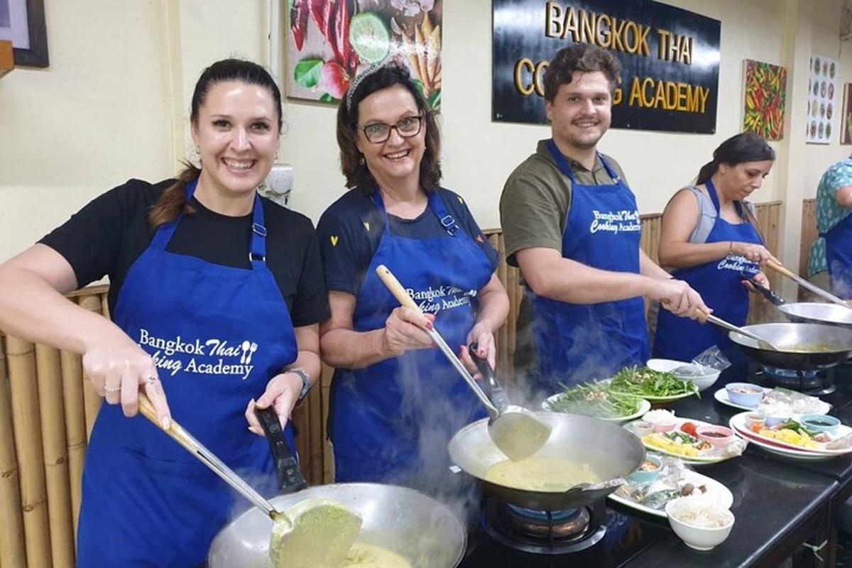 a group of people in a kitchen preparing food