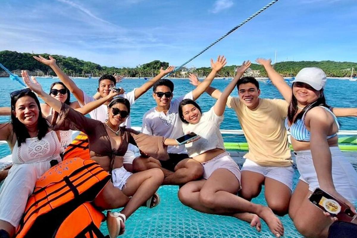 a group of people on a boat in the water