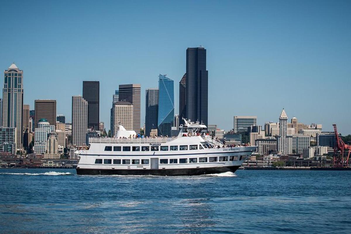 a large boat on the water in front of a city