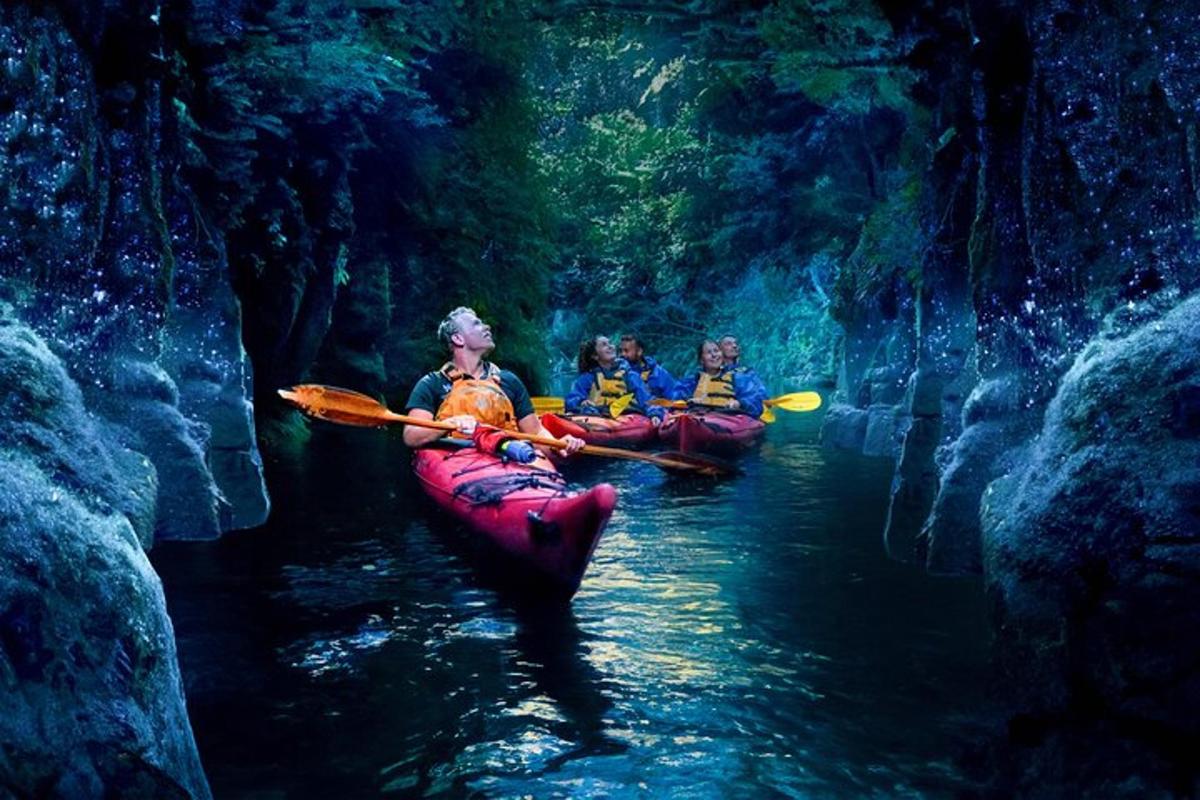 a group of people in kayaks in a cave
