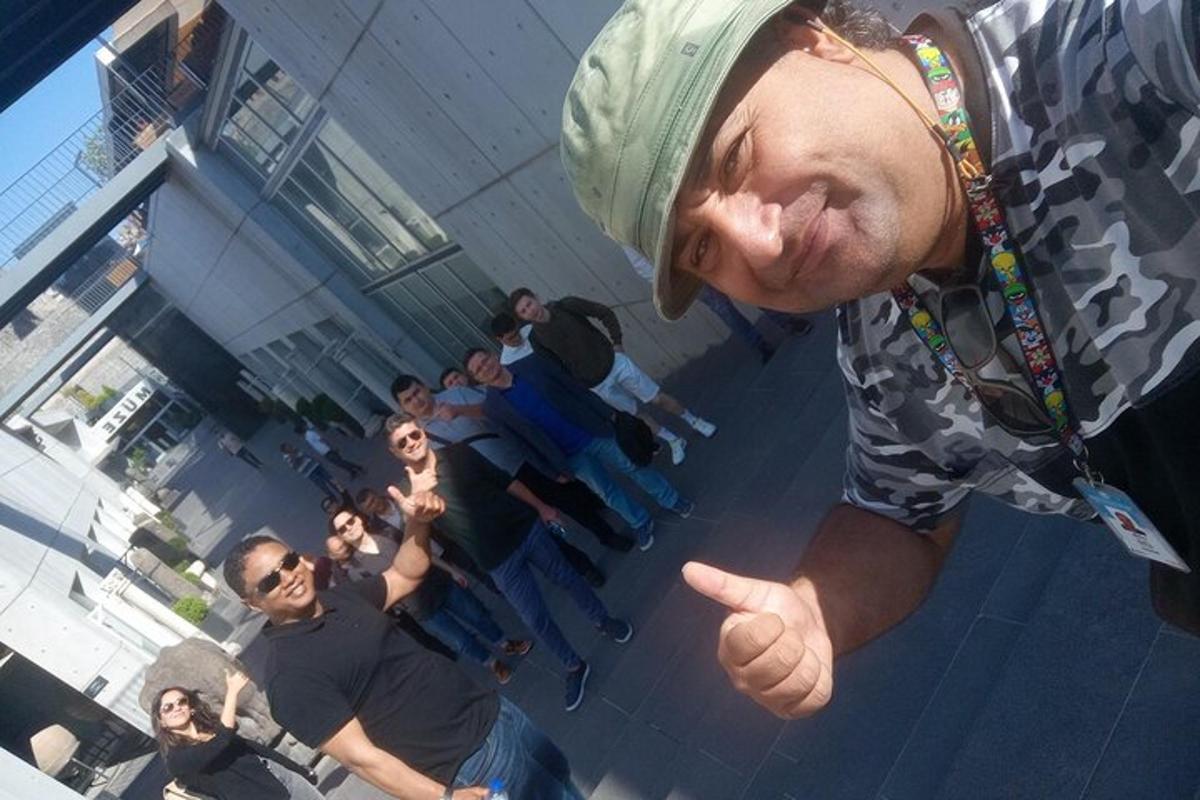 a man giving a thumbs up in front of a group of people