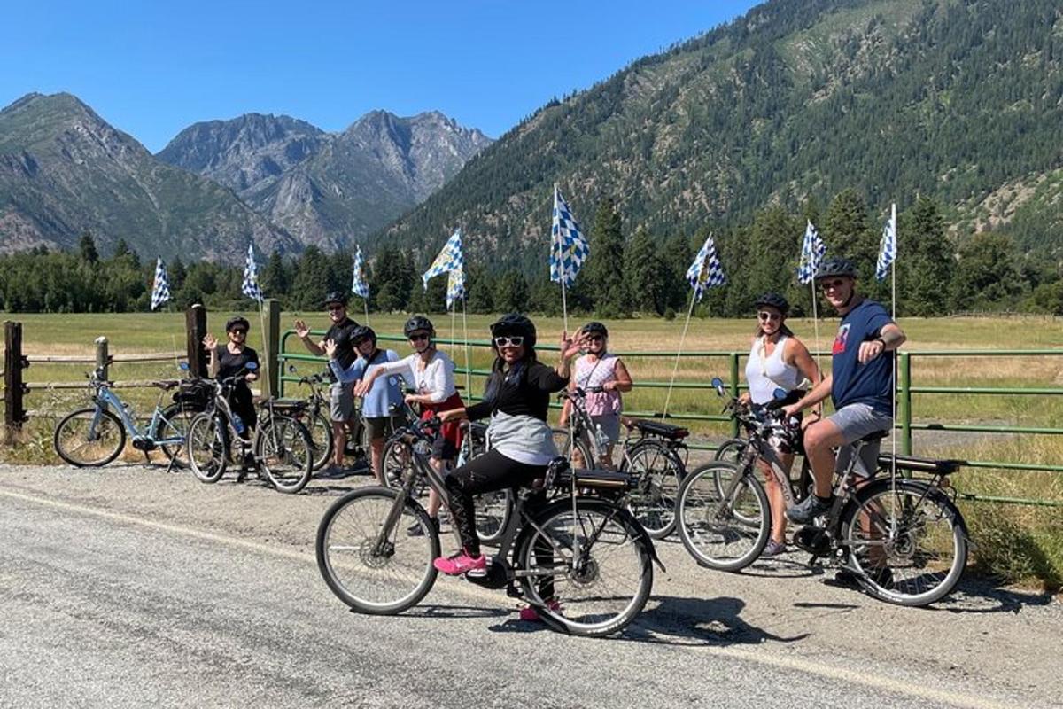 a group of people riding bikes on a road