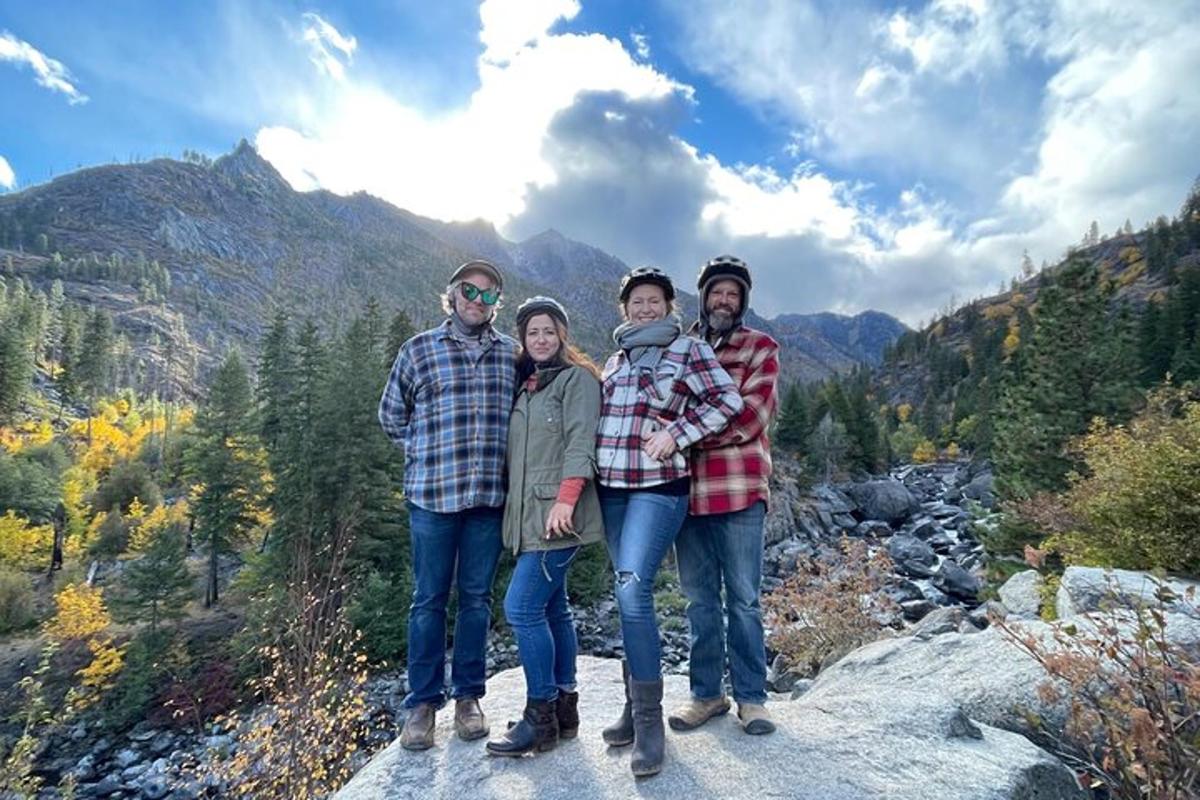 a group of people standing on top of a mountain