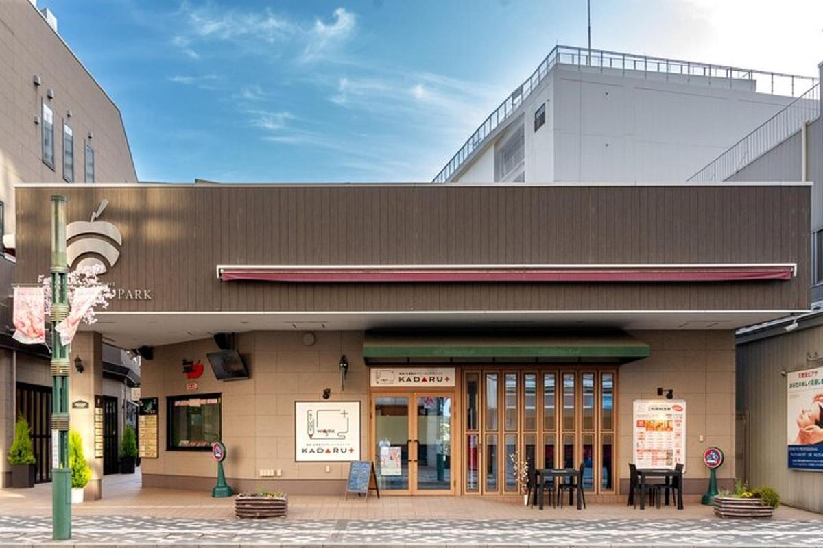 a building with tables and chairs in front of it