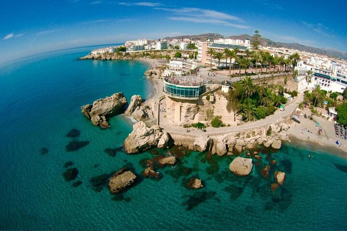 an aerial view of a beach with rocks in the water