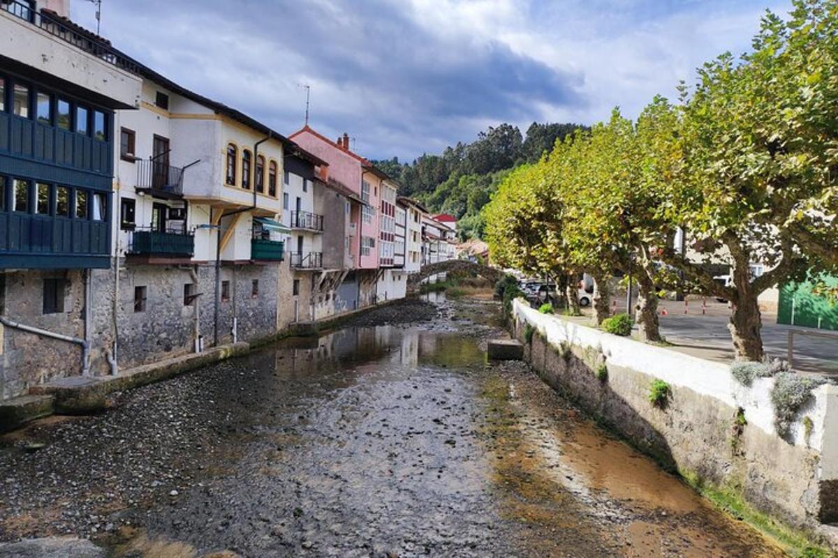 a river in the middle of a city with buildings