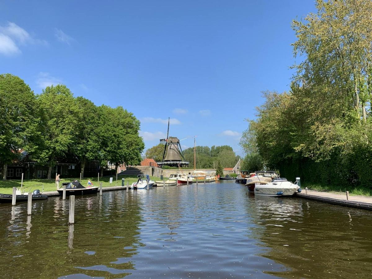 a group of boats docked on a river
